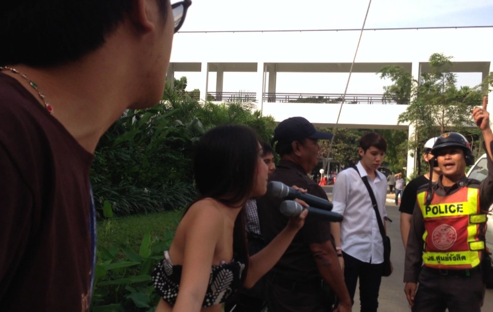 Aum facing the policeman.jpg